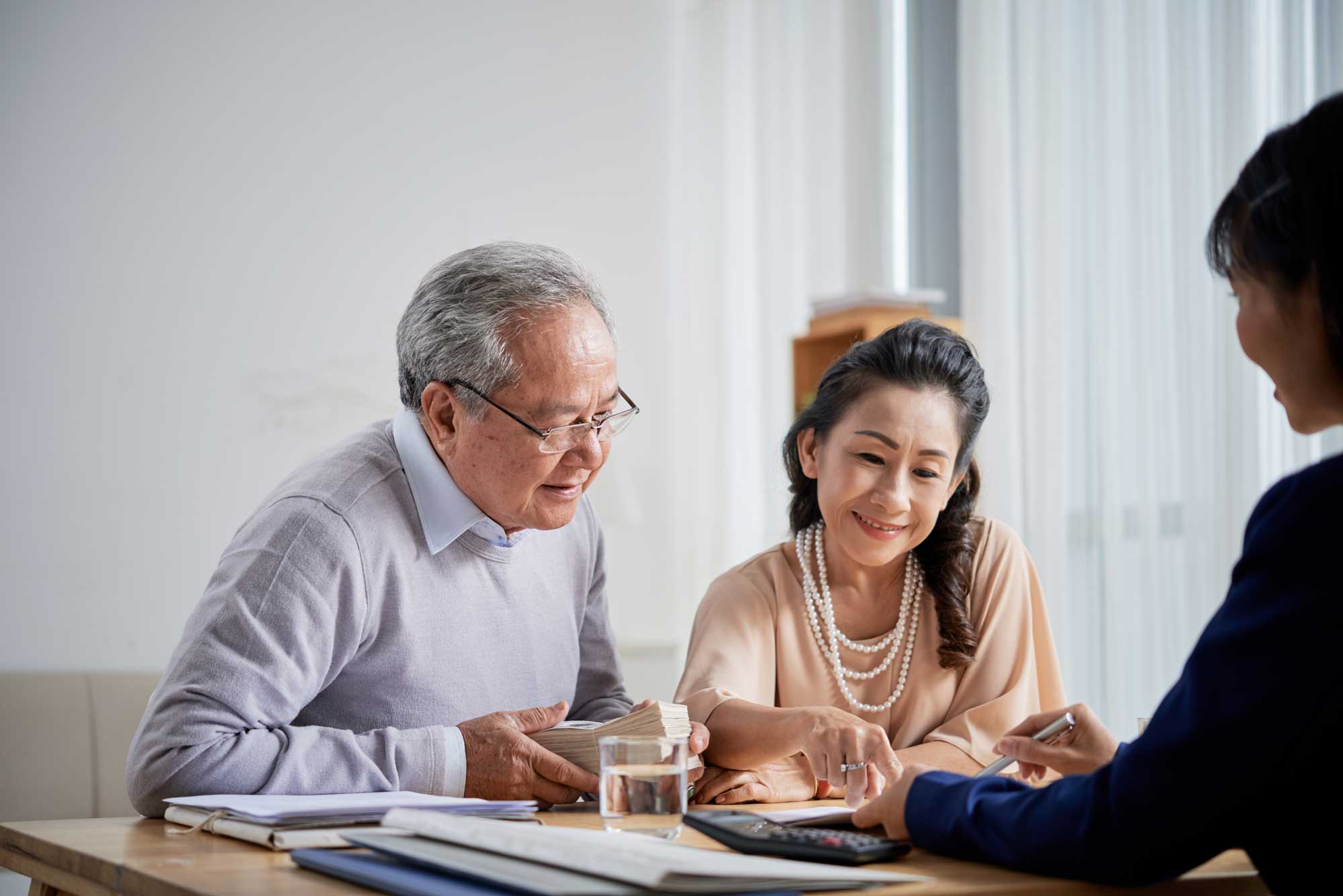 senior-couple-working-with-advisor